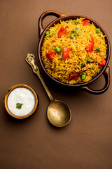 Tomato  pulav/Pilaf made using basmati rice, served in a bowl. selective focus