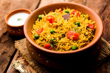 Tomato  pulav/Pilaf made using basmati rice, served in a bowl. selective focus