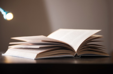 open book on wooden table