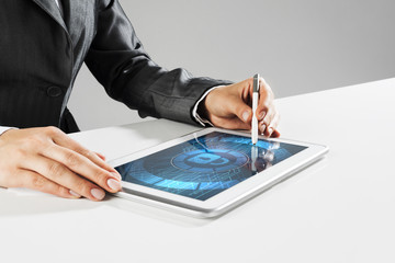 Internet security concept with woman working on media screen with stylus