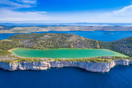 Aerial view of the Salt lake in nature park Telascica, Croatia, Dugi otok, big stone cliffs above the sea
