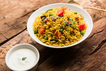 Tomato  pulav/Pilaf made using basmati rice, served in a bowl. selective focus