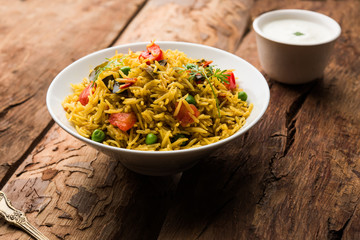Tomato  pulav/Pilaf made using basmati rice, served in a bowl. selective focus