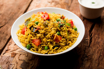 Tomato  pulav/Pilaf made using basmati rice, served in a bowl. selective focus