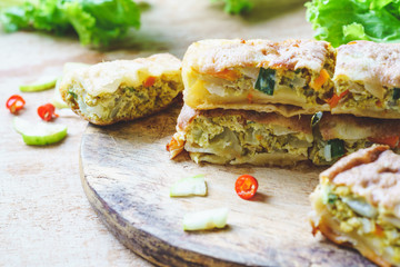 Close up selective focus of murtabak or martabak or mutabbaq or Mataba. Murtabak is a stuffed pancake or pan-fried bread which is commonly muslim food found in many country in Asia.