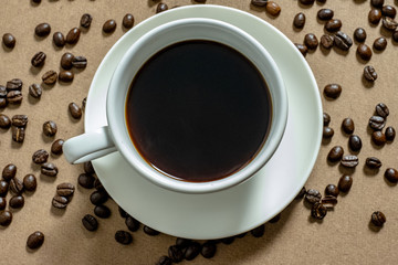 White coffee cups and coffee beans on the table.Top view.