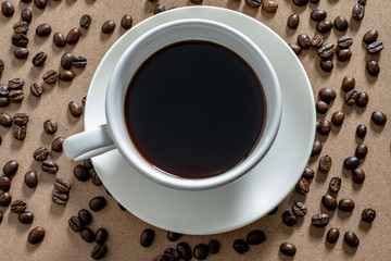 White coffee cups and coffee beans on the table.Top view.
