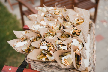 Coziness and style. Modern event design. Lounge zone and european traditional wedding ceremony decoration outdoors in the restaurant before the reception.