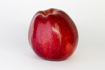 red Apple on a white background, close-up