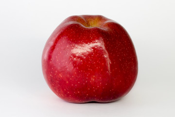 red Apple on a white background, close-up