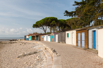 Obraz premium tiny colorful houses made of wood on the beach