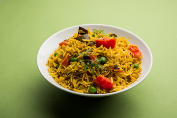 Tomato  pulav/Pilaf made using basmati rice, served in a bowl. selective focus