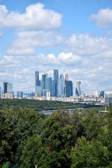 Fototapeta na wymiar Moscow, Russia - July 8, 2019: The view of the Moscow International Business Center skyscrapers and cloudy sky from the Sparrow Hills observation deck