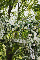 Coziness and style. Modern event design. Lounge zone and european traditional wedding ceremony decoration outdoors in the restaurant before the reception.