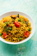 Tomato  pulav/Pilaf made using basmati rice, served in a bowl. selective focus