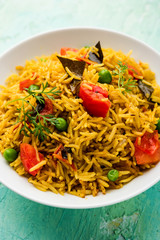 Tomato  pulav/Pilaf made using basmati rice, served in a bowl. selective focus