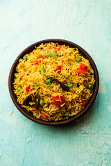 Tomato  pulav/Pilaf made using basmati rice, served in a bowl. selective focus
