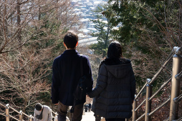 Lover holding hand and walk step by step in autumn , romantic scene, together life.