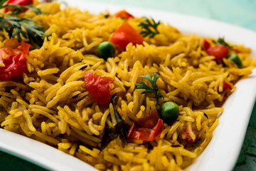 Tomato  pulav/Pilaf made using basmati rice, served in a bowl. selective focus