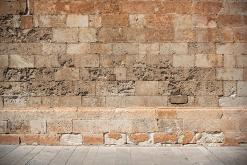 Ancient Brickwall Texture Background. The Wall of a Spanish Church made out of Sandanstone,...