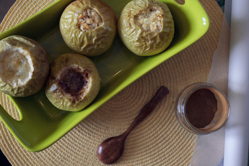 apples with cinnamon on a yellow background