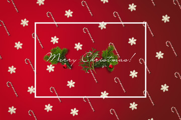 Merry Christmas greeting card with white border. Holiday card with canes and snowflakes pattern, pine branches and balls.