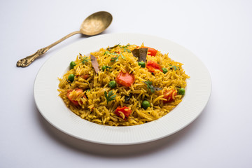 Tomato  pulav/Pilaf made using basmati rice, served in a bowl. selective focus