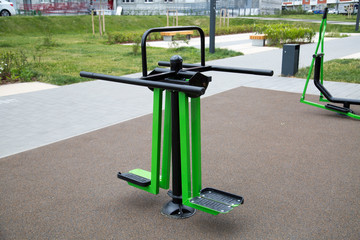 Power leg trainer made of metal on the Playground in the city outdoors. Sport is a healthy lifestyle Hobby.