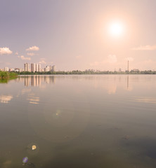 Sunset over the lake. Outside the city.