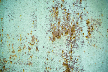 Old corroded metal wall background with flaky blue green paint .Rusty flaky cracked metal surface.Abstract the surface texture of the old metal.