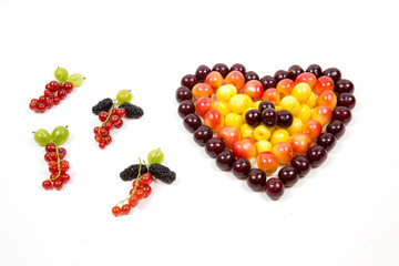 Cherry berries cherries in the form of a heart of red pink yellow and tassels of red currant...