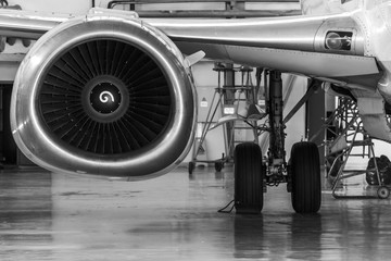 Close-up view of the jet engine of the aircraft. Black and white photo.