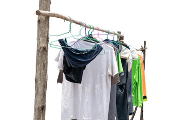 Dry clothes hanging on wooden clothes rack after washing clothes in camping outdoor isolated on white background. Washing and Cleaning concept.