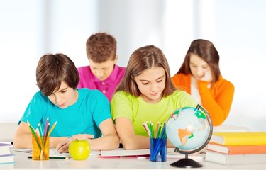 Fototapeta premium School Children in the Classroom Writing /