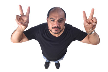 Latin american man making the victory sign on a white background