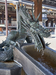 A dragon supplying water at purification fountain of Higashi Hongan-ji in Kyoto, Japan.