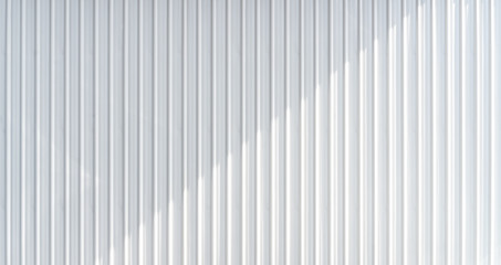 White corrugated metal wall texture with casting shadow. Horizontal background texture.