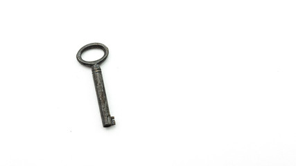 Small antique key on white background