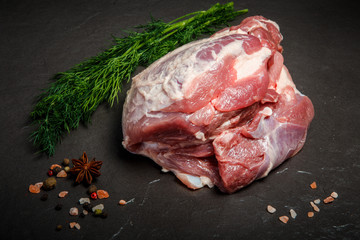 top view on large piece of marbled raw meat with green dill