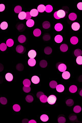 Unfocused abstract colourful bokeh purple background. defocused and blurred many round purple light