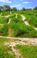 On the green hills there are many different tracks for bike trials and autodrome