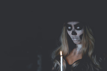 Portrait of woman make up ghost face,Mexico Cityâ€™s Day of the Dead parade on Sunday honored those killed in two recent earthquakes,Thailand people,Light a candle to commemorate the people away.