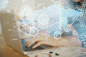Social network theme hologram with businessman working on computer on background. Concept of world wide web. Double exposure.