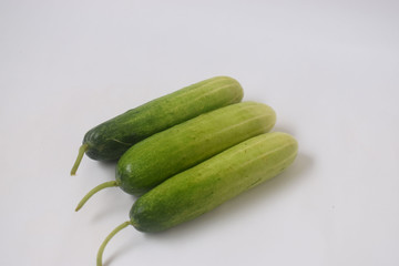 Fresh and raw cucumbers with white background 