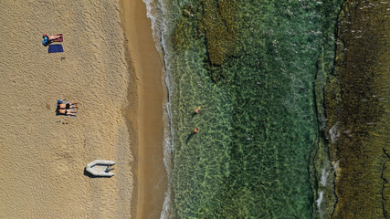 Aerial photo of famous sandy beach with turquoise clear sea of Megali Amos next to iconic and...