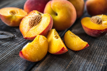 Fototapeta na wymiar Fresh organic peaches on old wooden table
