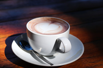 cup of coffee on wooden table