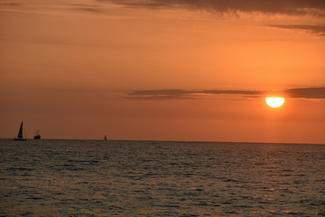 Golden Sunset at the Beach with Boat
