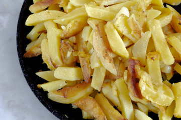 Fried potato on pan