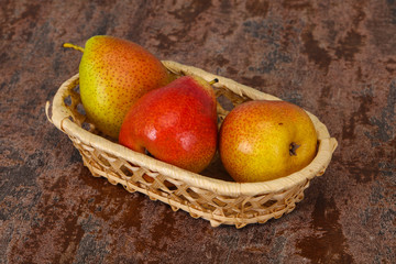 Pear heap in the wooden basket